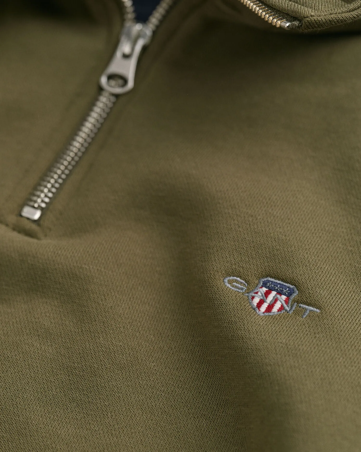 Felpa Shield con zip corta    