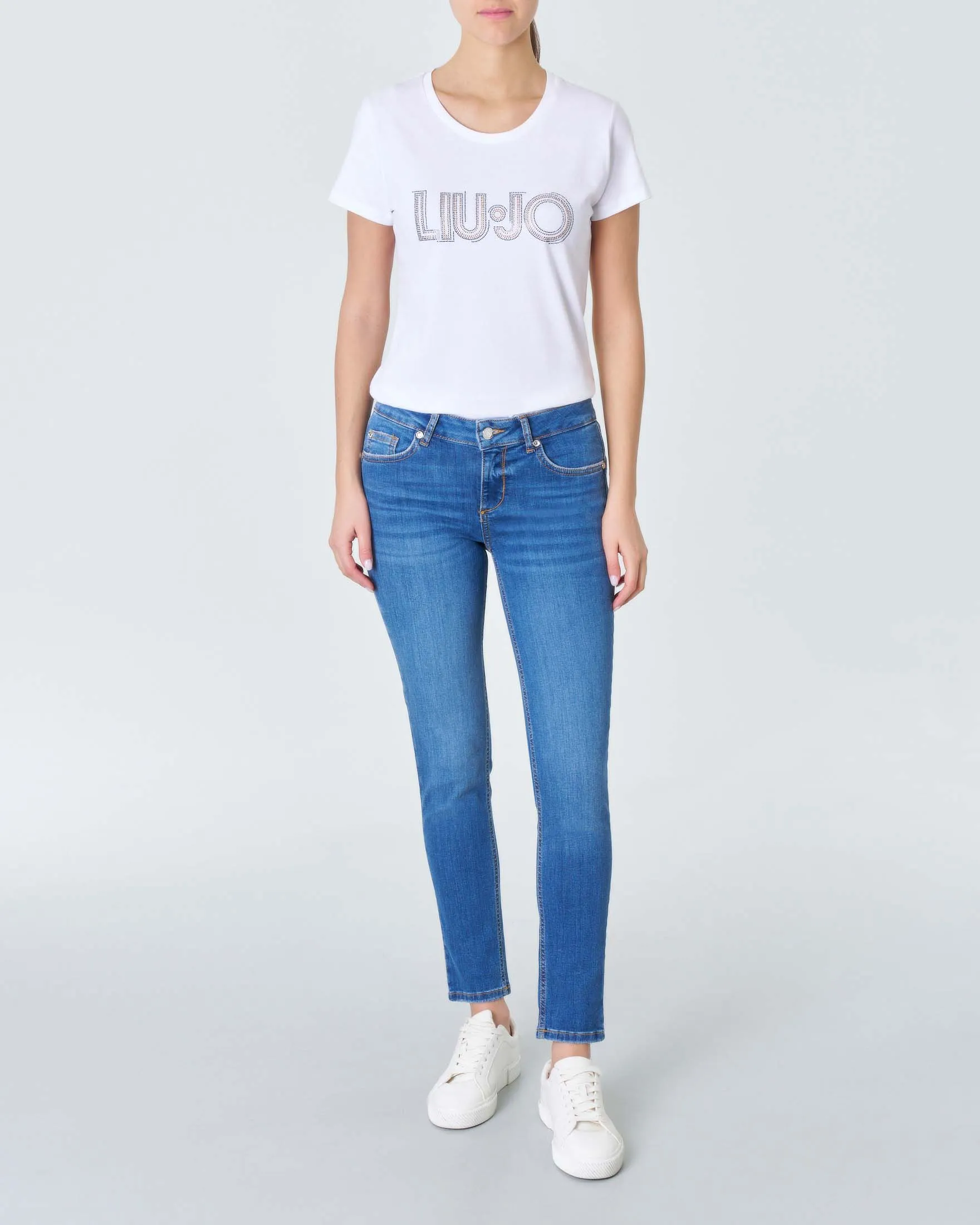 Jeans skinny-fit a vita bassa in cotone lavaggio medio con baffature