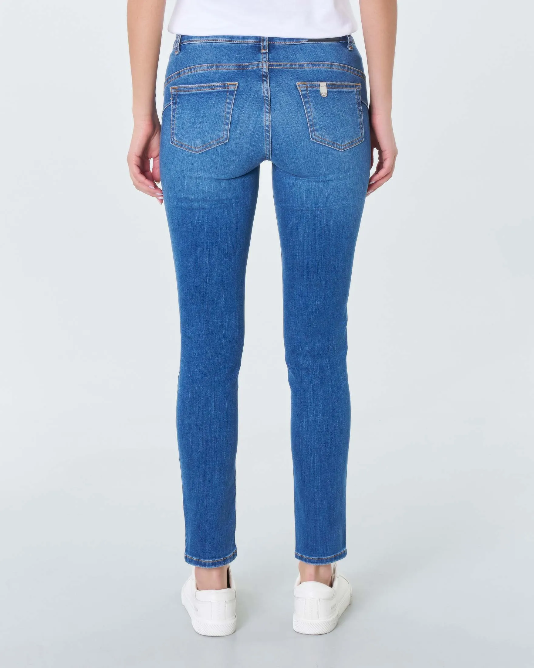 Jeans skinny-fit a vita bassa in cotone lavaggio medio con baffature